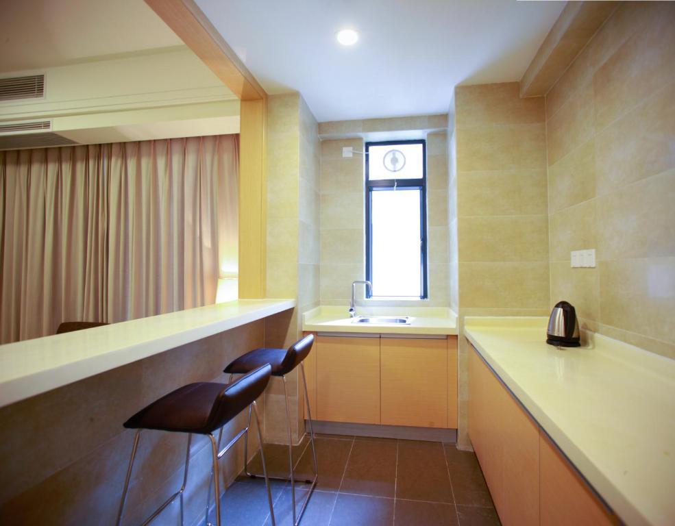 Xcellent International Serviced Apartment Guangzhou Værelse billede